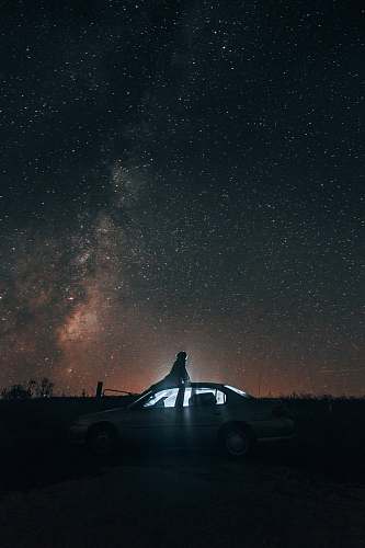 milky way white sedan under blue sky camping